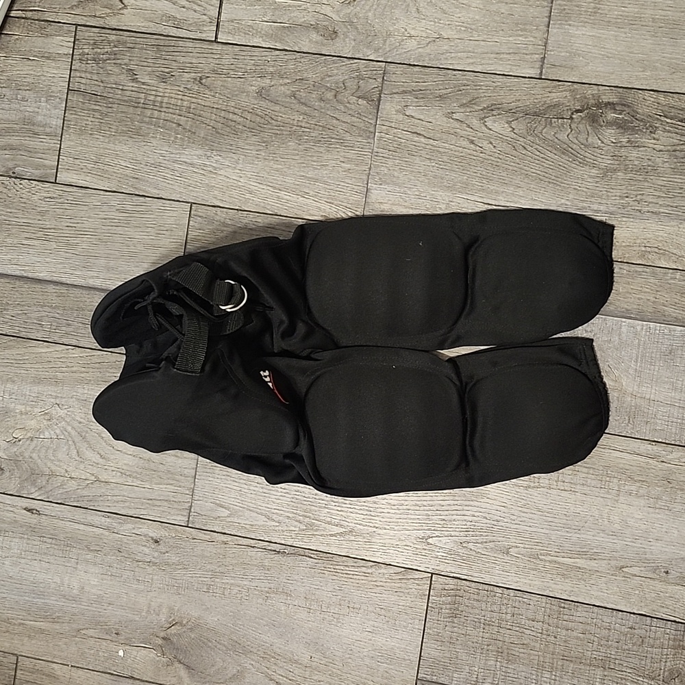 2 pair.. black padded schutt football pants